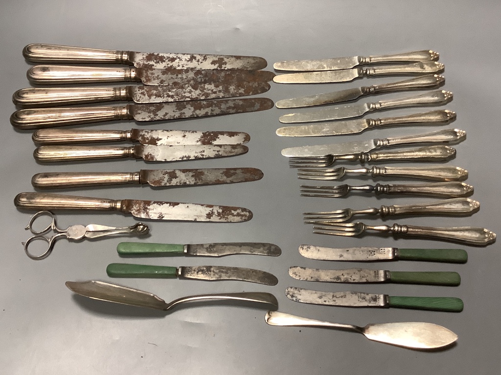 Four George IV silver handled table knives and four similar desert knives and a quantity of silver handled fruit knives and forks and two silver butter knives.